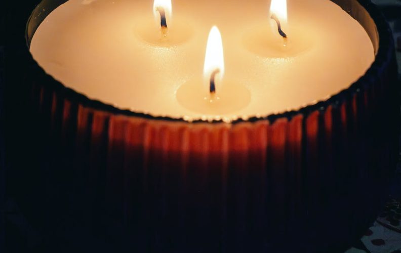 three flames burning on a candle