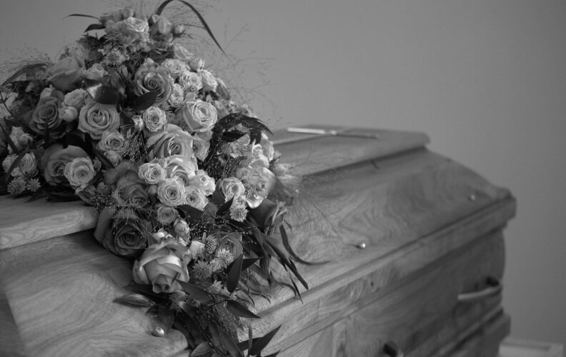 flowers decoration on wooden casket